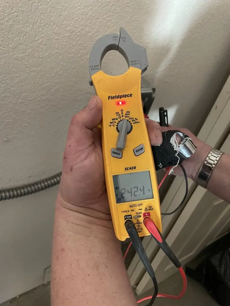 Voltage testing with clamp meter during Recessed Lighting Installation in Lebanon